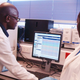 Scientists analysing data at the South-South Malaria Research Partnership project laboratory in Kenya.
